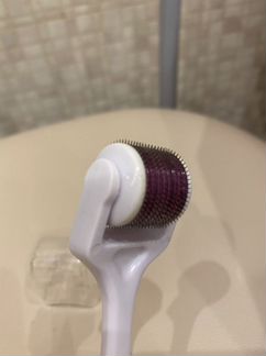 Роликовый массажер для лица