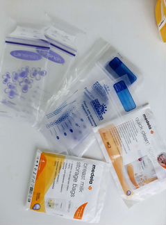 Молокоотсос ручной, накладки на грудь и пакеты для